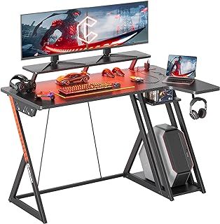 CubiCubi Gaming Desk with LED Lights & Power Outlets, 100 cm L Shaped Carbon Fiber Surface Desk with Storage Shelves, Small Corner Computer Desk with Monitor Shelf, Black
